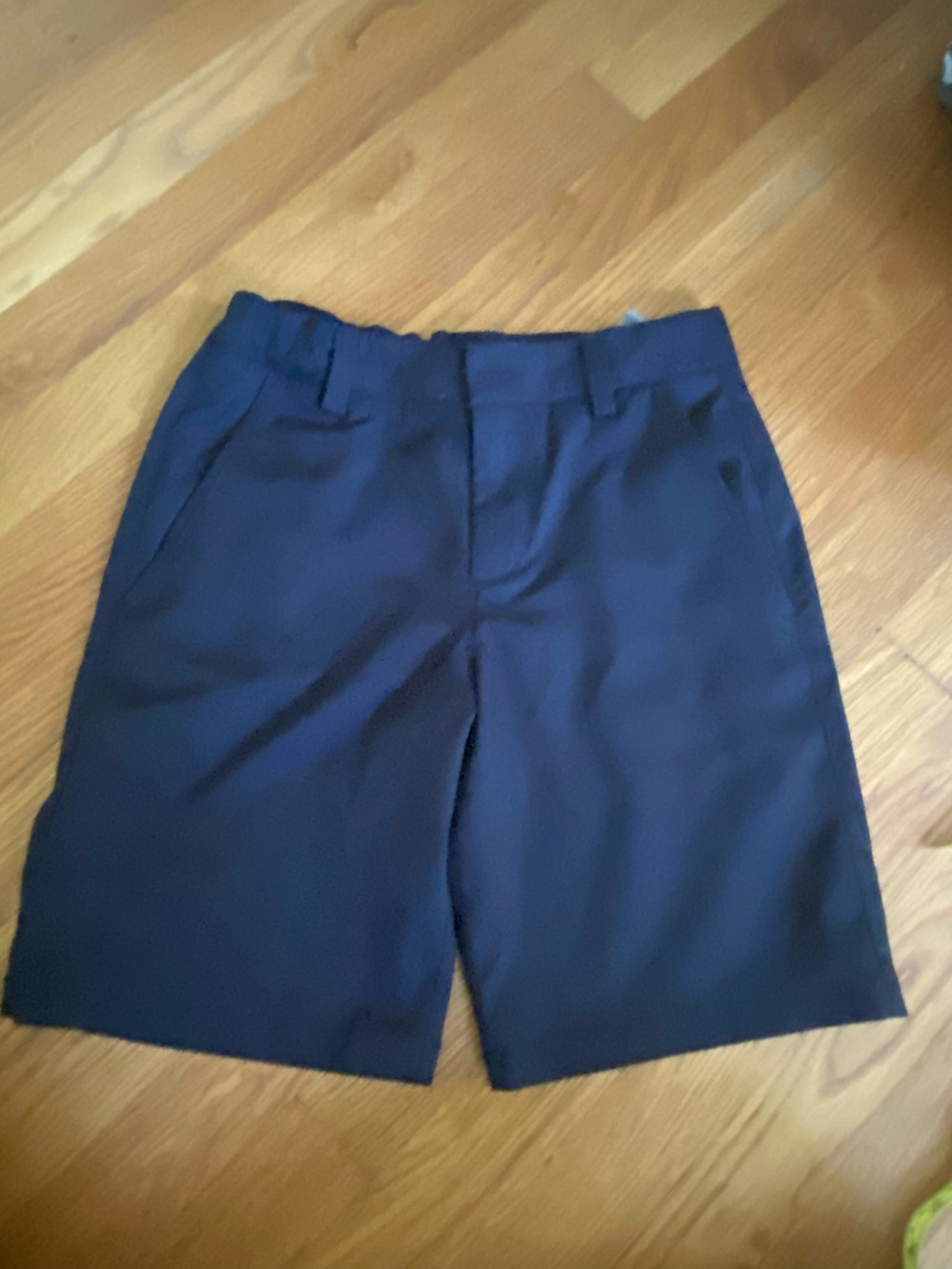 Boys Under Armour black golf shorts